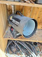 Front angled view of heater showing barrel and label