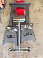 Group shot showing saw horse, two stools, bucket, dolly and roller stand