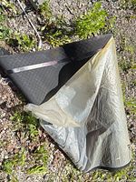 Mat rolled back showing top diamond tread and underside