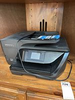 Front view of HP OfficeJet Pro 6978 printer with ink cartridges on document feeder