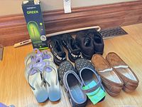 Group shot of footwear pairs, Superfeet insoles and shoehorn