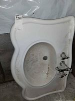 Top view of porcelain sink showing basin and faucet