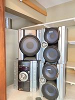 Full view of stereo system showing main unit, subwoofer and speakers