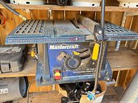 Front view of Mastercraft 10-inch table saw with controls and rip fence visible