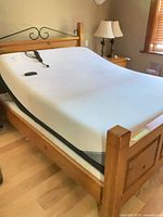Bed with mattress raised showing adjustable function