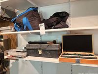 view of toolbox, hammer, tool bags and organizer on shelf