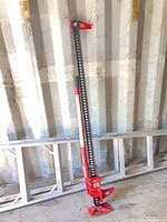 Full view of 60-inch red and black utility jack standing upright