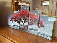 Front view of all five wrapped canvas panels on dresser