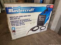 Box front showing Mastercraft MIG/Flux-Core Welder Kit