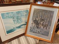 Both framed wolf prints side by side