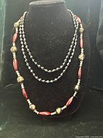 All three necklaces displayed on bust form