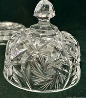 Dome lid showing starburst cuts and faceted finial