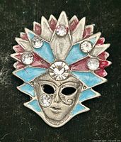 Front view of brooch showing enamel colors and rhinestones