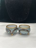 Front view showing both cloisonné bowls, dragon and cloud motif visible