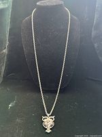 Full view of necklace on bust form showing length and pendant