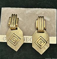 Front view of both earrings on Vendome card