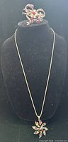 Full view showing necklace on bust and cuff bracelet above