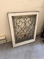 Front view of full leaded glass window showing design and frame