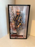 Front view of boxed Iris Apfel Barbie doll