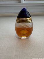 Front view of perfume bottle showing label and fill level