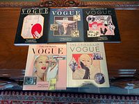 Front covers of all five Vogue decade books displayed