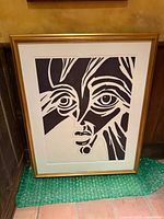 Front view of framed portrait showing artwork, mat, and frame