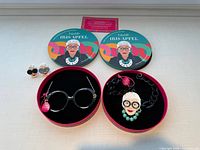 All items overview with tins, necklaces in boxes, and rings