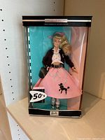 Front view of boxed Nifty 50's Barbie doll