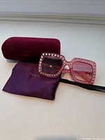 Sunglasses, velvet case, soft pouch displayed