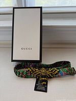 Headband displayed with Gucci box