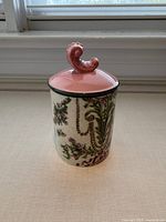 Front view of Gucci Richard Ginori scented candle showing floral design and lid