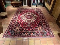 Full view of rug laid flat showing overall design and colours