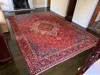 Full view of Persian Bakhtiari wool rug in room setting