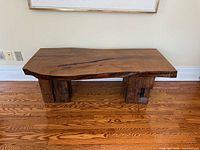 Front angled view of entire bench highlighting live-edge top and block legs