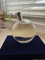 Front view of Hermès Eau des Merveilles deodorant spray bottle