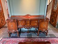 Front view of walnut sideboard showing overall design and finish