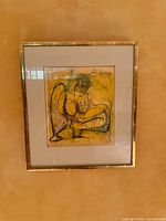 Frontal view of framed artwork showing image, mat, frame, signature