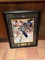 Front view of framed dual-signed photograph