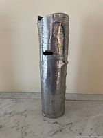 Front view of silver bark-textured cylindrical vase