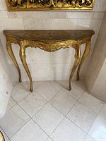 Front angled view of giltwood console table