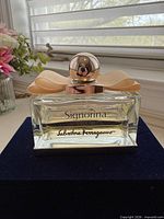Front view of perfume bottle showing label and fill level