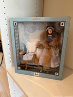 Front view of boxed Barbie and greyhound figure