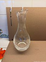 Full view of clear fluted crystal carafe front angle
