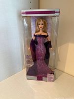 Front view of sealed February Amethyst Barbie doll in box