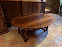 Full view of oval oak table with leaves raised