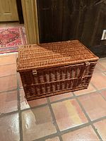 Front view of closed wicker picnic basket