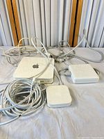 Overall view of Time Capsule, AirPort Express, power adapter, adapter box, and cables