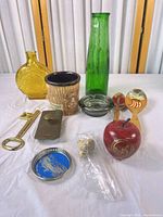 Group shot of entire lot showing all 11 items on white surface