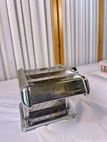 Front view showing Marcato logo and chrome body