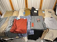 All pants and shorts laid out showing colors and variety